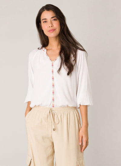 <p>Add a playful touch to your wardrobe with Yest's Fara Blouse! This off-white blouse is made from 100% viscose and features charming embroidery along the neckline. The three-quarter length sleeves with smocked elasticated cuffs add a stylish touch. Perfect for adding a fun flair to any outfit!</p> <p>&nbsp;</p> <p>Made of 100% Viscose, machine wash at 30 degrees and air dry where possible, low iron if needed&nbsp;</p> <p>&nbsp;</p>