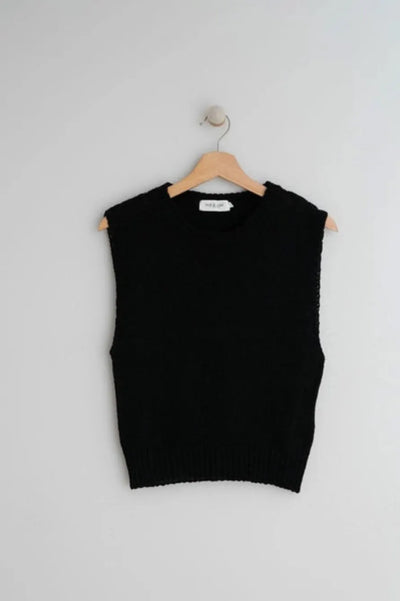 <p>Introducing our elevated basic: the Indi &amp; Cold - Chaleco Knit in Negro. This plain black vest is perfect for layering this spring and summer. (No need to be cold in this cold knit!) Stay stylish and warm with this essential addition to your wardrobe.</p> <p>&nbsp;</p> <p>Made of 75% recycled cotton, 20% polyester, 5% other fibers, Machine wash 30&nbsp;</p>