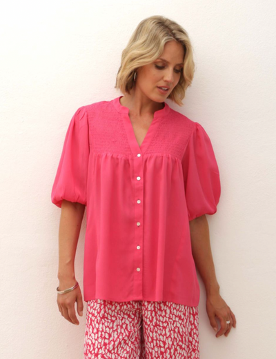 <p>Sometimes you just need a simple self coloured blouse to top off an outfit.&nbsp; This Pomodoro shirt in either white or fusia pink fits the bill.&nbsp; It is sleeveless, collarless and buttons through the front.&nbsp; It is the perfect shirt to wear with a trouser suit or patterned trousers. <br></p> <p>100% Viscose&nbsp;&nbsp; 30 degree gentle machine wash</p>