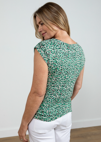 <p>The iconic surfside capped sleeved top this time in a small abstract suggestion of an animal print :) in shade of leaf green and subtle daubes of&nbsp; taupe, black and ivory.</p> <p>&nbsp;</p> <p>95% ecovero Viscose and 5% Elastane.&nbsp; 30 degree machine washable.</p>