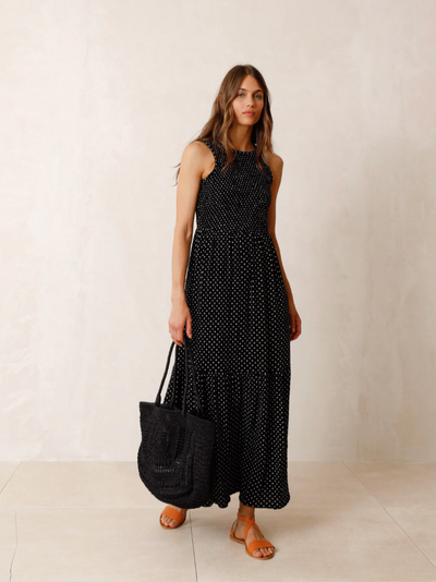 <p>The Epitome of summer sophistication, this black maxi dress with small white dots features a ruched sleeveless top and&nbsp; a long flowing tiered skirt.&nbsp; Can be dressed up or down.</p> <p>100% viscose 30 degree gentle machine wash inside out.</p>