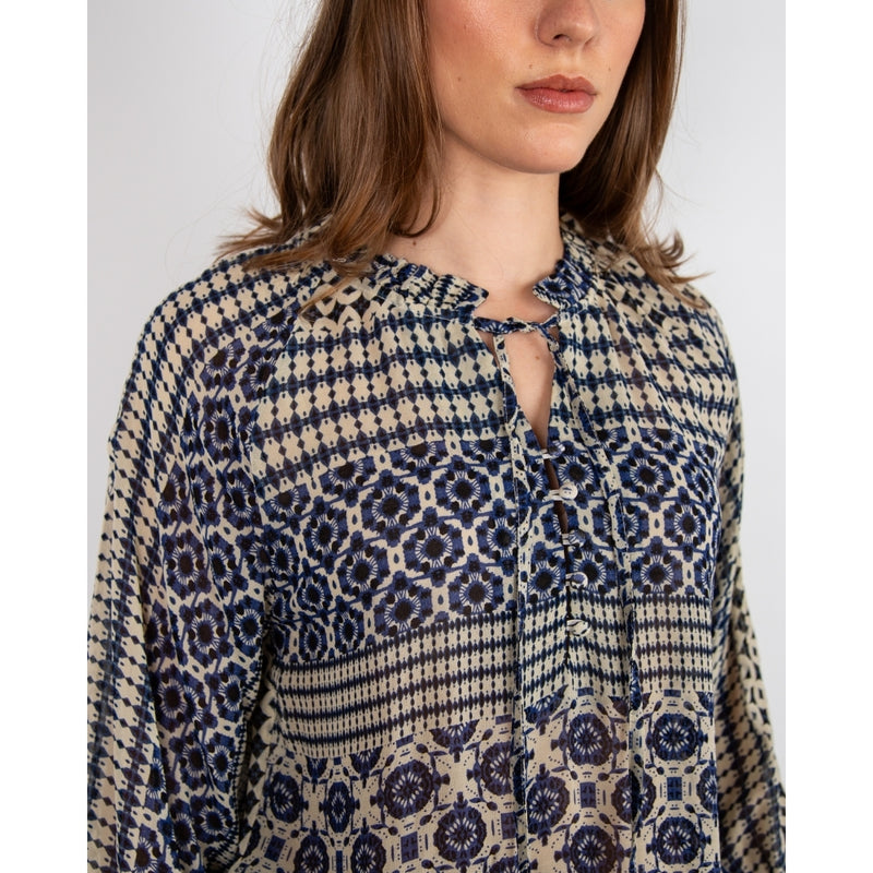 <p>This sheer flowy blouse is perfect for a playful spring summer look. With its ethnic stripe design and deep navy color, the Pomodoro blouse adds a touch of quirkiness to any outfit. Lightweight and airy, it&