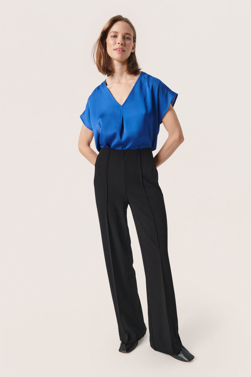   An essential addition to your wardrobe, the Iona Marija Top from Soaked In Luxury is plain for easy mixing and matching.  Framed with a v-neckline and short sleeves, it is made with durable fabric for longevity of wear and is an everyday wardrobe essential.     Machine wash at 30 degrees.