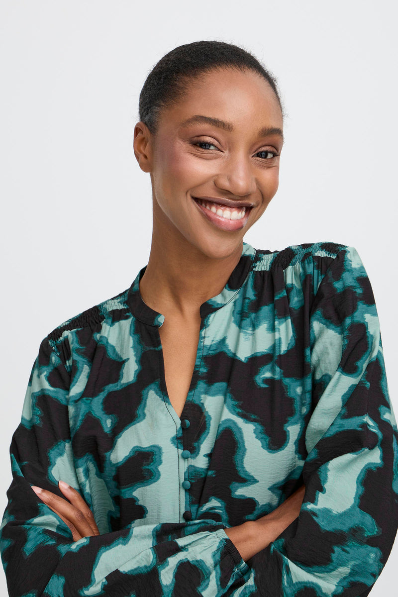 model wearing B Young - Ibine Smock LS Blouse in Blurry Green. close up view