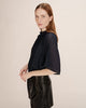 Add a touch of sparkle to your outfit with the Grace & Mila Topaze Sheer Blouse. This dark blue, short-sleeved blouse features a delicate sheer fabric that floats effortlessly, while the frill neckline adds a charming, playful flair. Perfect for brightening any day or night look with subtle shimmer and feminine details.

100% polyester. Handwash.