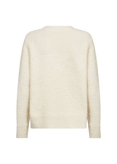 Cream-colored sweater on a white background